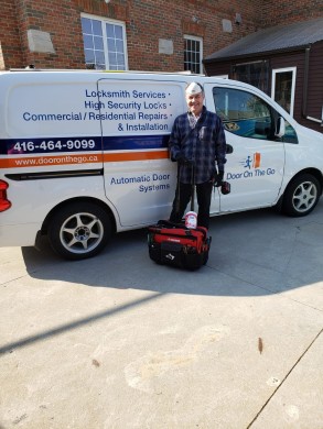 Tony from Door On The Go ready for a repair job with tools, safety facemask, gloves and Lysol during COVID-19